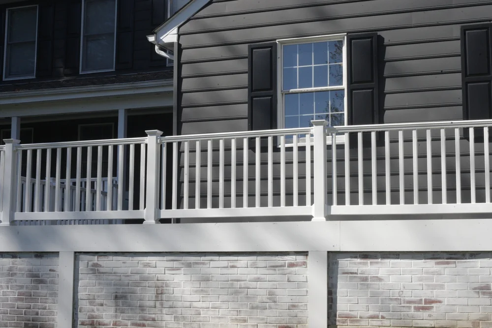 Clean home siding and railing after washing